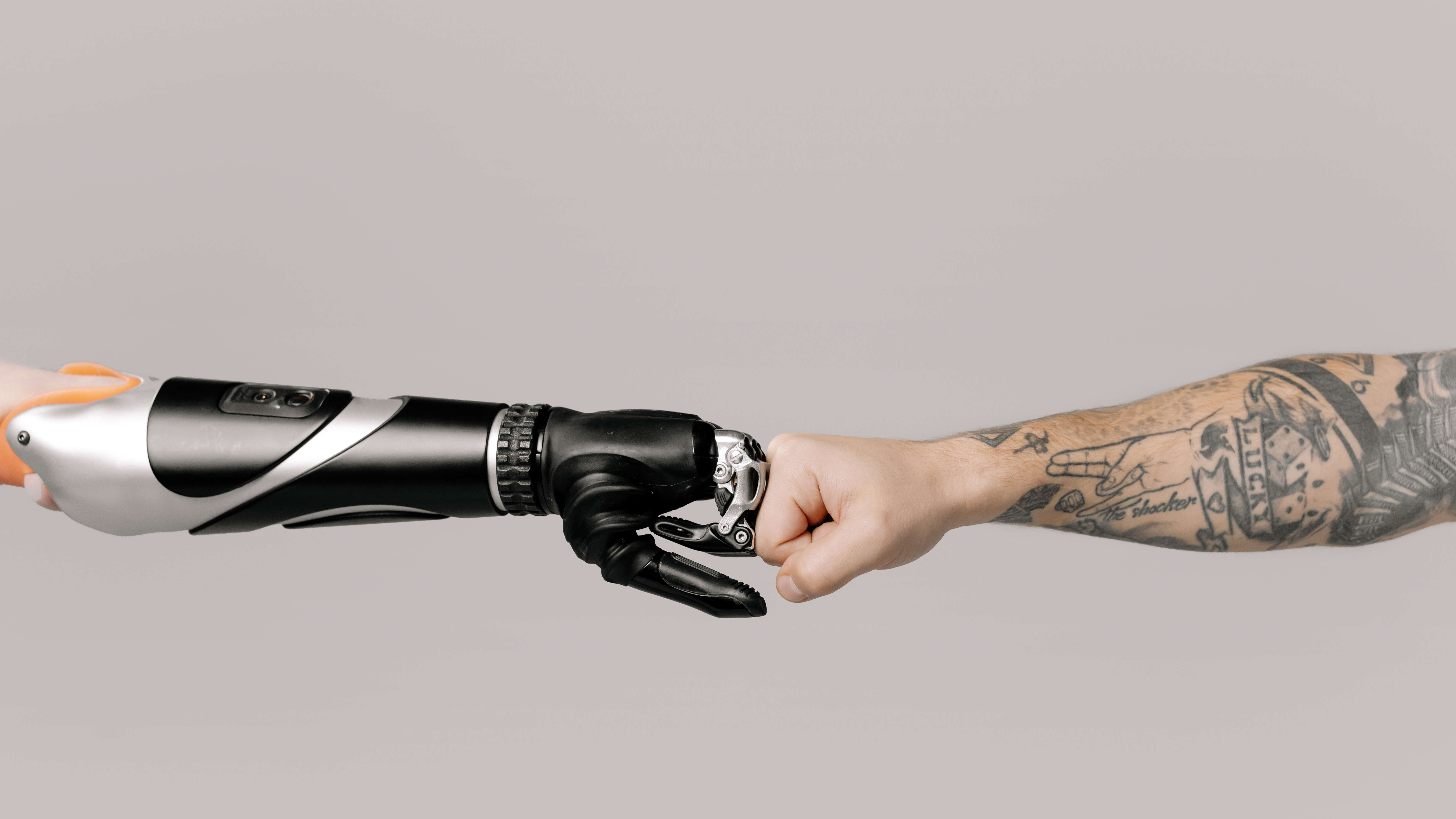 Human and Robot Arm Fistbumping